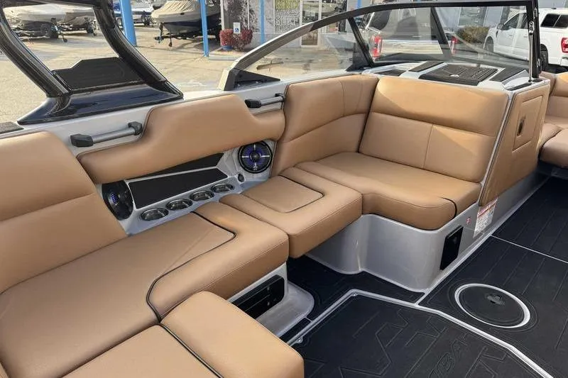 Slide: The Image of Luxurious interior of 2026 Moomba Mondo boat with tan leather seating. - 12