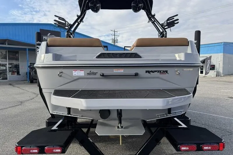 Slide: The Image of 2026 Moomba Mondo boat rear view with Raptor engine, parked outside dealership. - 5