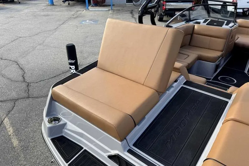 Slide: The Image of 2026 Moomba Mondo boat with tan seating and sleek interior design. - 9