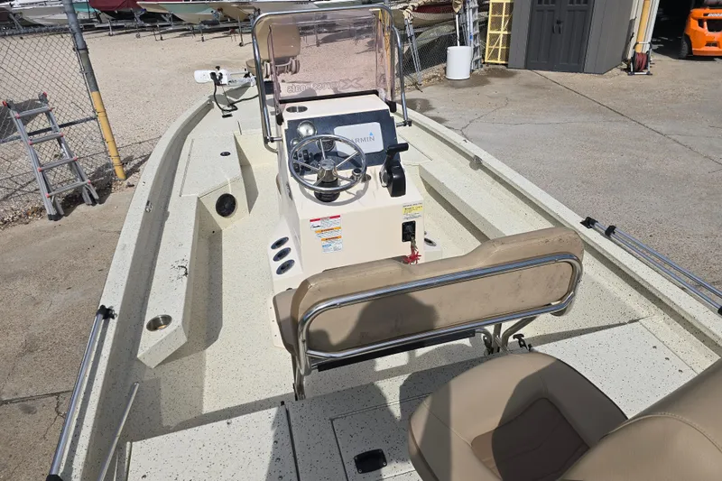 Slide: The Image of 2021 Xpress H22B Bay boat interior with steering console and seating. - 12