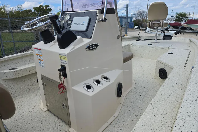 Slide: The Image of 2021 Xpress H22B Bay boat interior with Garmin navigation system and steering console. - 8