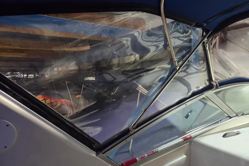 Slide: The Image of Interior view of a 1996 Sea Ray 290 Sundancer boat with clear canopy. - 16