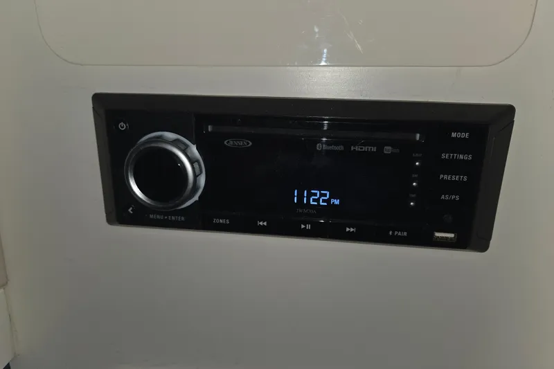 Slide: The Image of Jensen stereo system in 1996 Sea Ray 290 Sundancer, displaying 11:22 PM. - 23