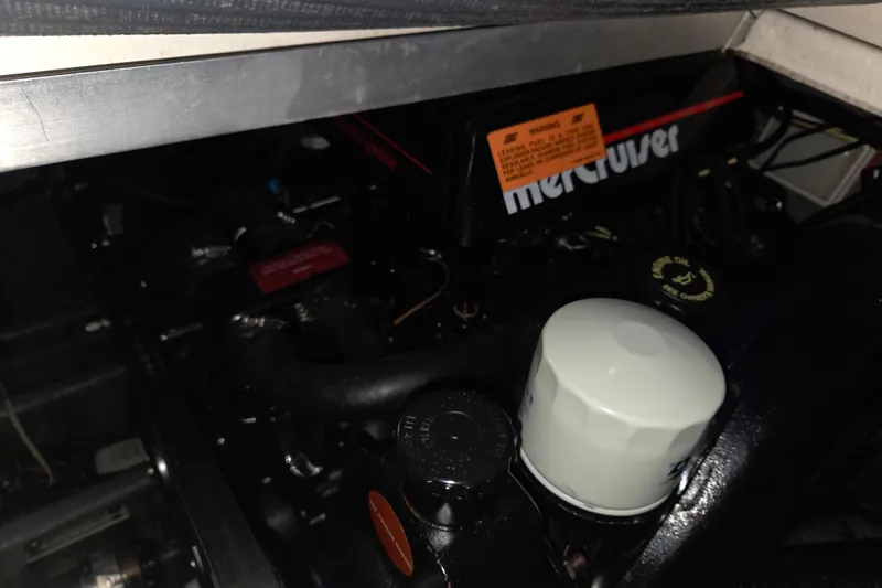 Slide: The Image of Engine compartment of 1996 Sea Ray 290 Sundancer with MerCruiser components visible. - 34
