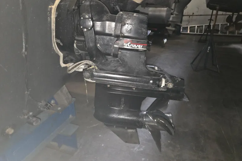 Slide: The Image of 1996 Sea Ray 290 Sundancer MerCruiser outdrive in a garage setting. - 37