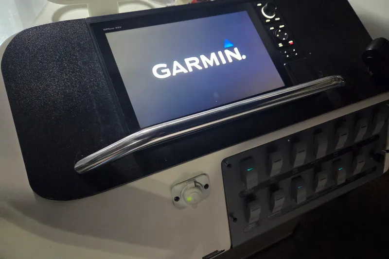 Slide: The Image of Garmin navigation system on 1996 Sea Ray 290 Sundancer boat dashboard. - 7