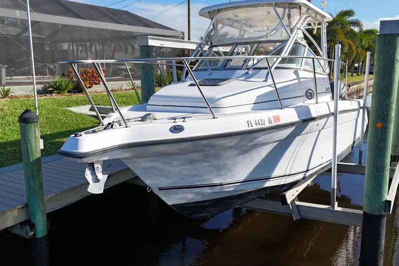 Slide: The Image of 2008 Century 2600 Walk-Around boat docked, featuring sleek design and sturdy build. - 8