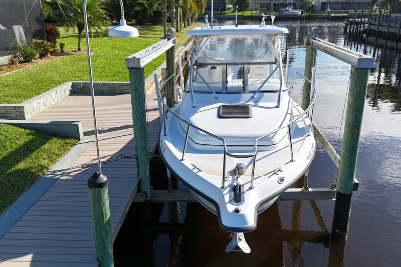 Slide: The Image of 2008 Century 2600 Walk-Around boat docked on a sunny waterfront. - 9
