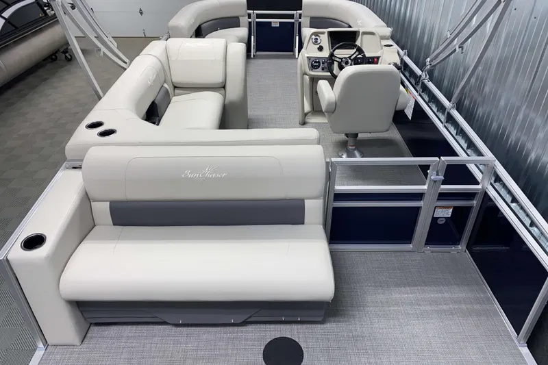 Slide: The Image of 2025 SunChaser Vista 20 CRB pontoon boat interior with plush seating and modern helm. - 12