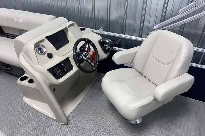 Slide: The Image of SunChaser Vista 20 CRB 2025 boat interior with steering console and captain's chair. - 7