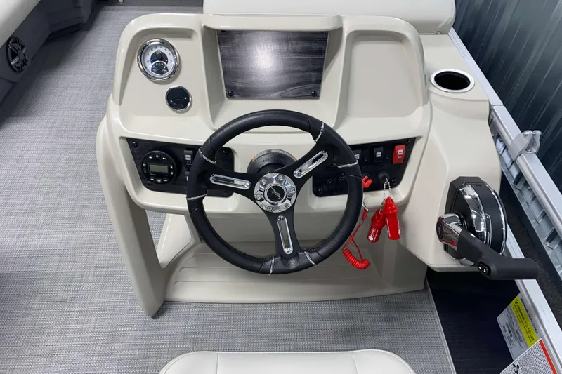Slide: The Image of Steering console of 2025 SunChaser Vista 20 CRB boat with modern controls and dashboard. - 9