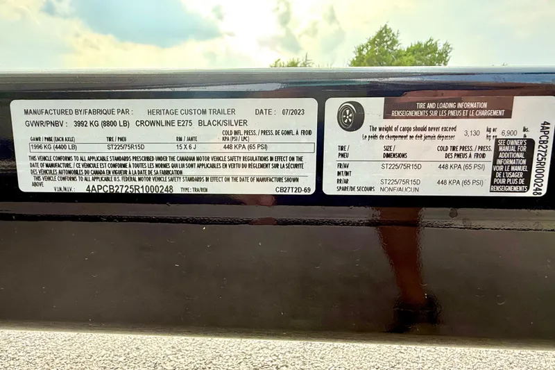 Slide: The Image of Label on a 2006 Cobalt 272 trailer, detailing tire and loading information. - 19