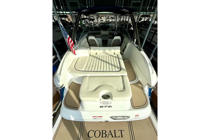 Slide: The Image of 2006 Cobalt 272 boat interior with seating and American flag. - 25