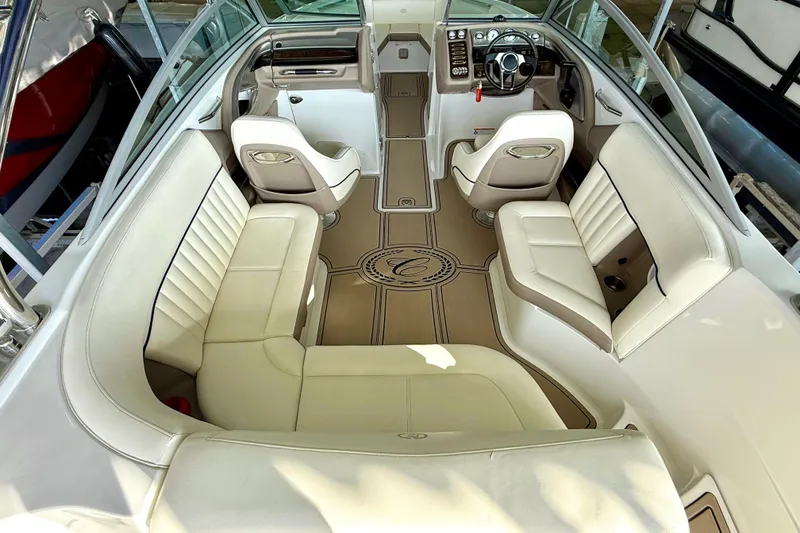 Slide: The Image of Interior of a 2006 Cobalt 272 boat with beige seating and sleek design. - 28