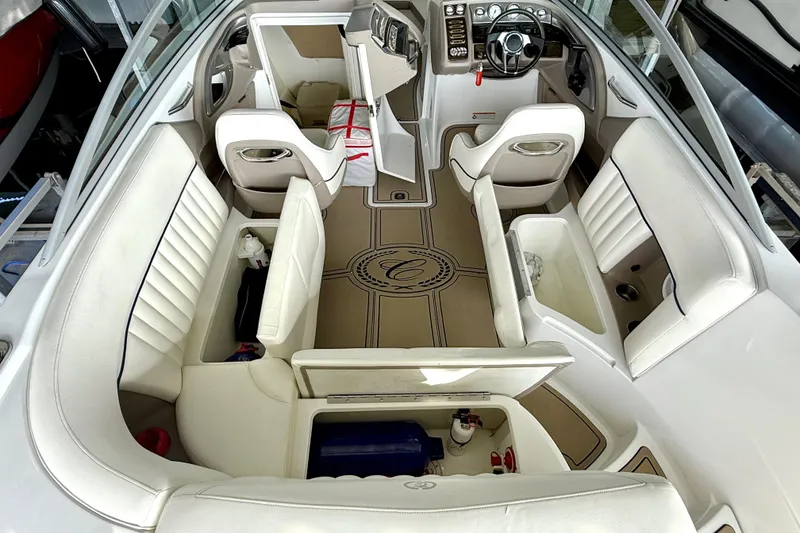 Slide: The Image of Interior of a 2006 Cobalt 272 boat with white seating and steering console. - 29