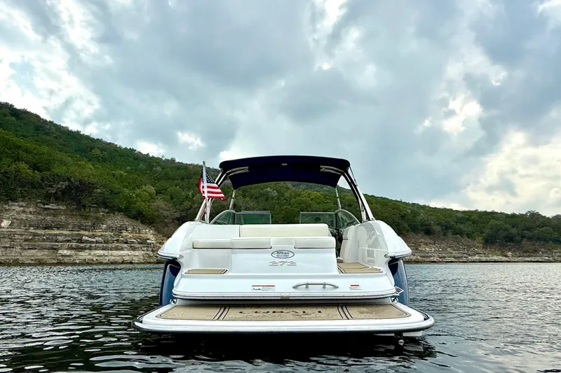 Slide: The Image of 2006 Cobalt 272 boat on a lake with scenic hillside backdrop. - 3