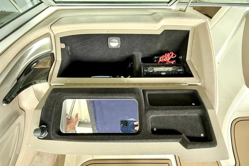 Slide: The Image of 2006 Cobalt 272 boat dashboard storage with compartments and mirror. - 36