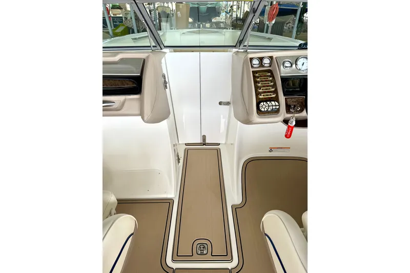 Slide: The Image of Interior view of a 2006 Cobalt 272 boat cockpit with control panel and seating. - 37