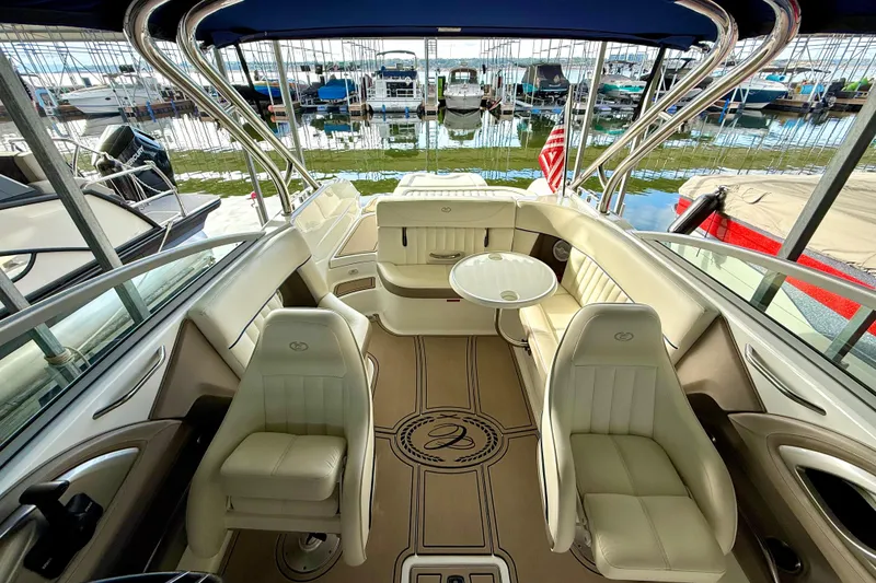 Slide: The Image of Interior of a 2006 Cobalt 272 boat with luxurious seating and table. - 48