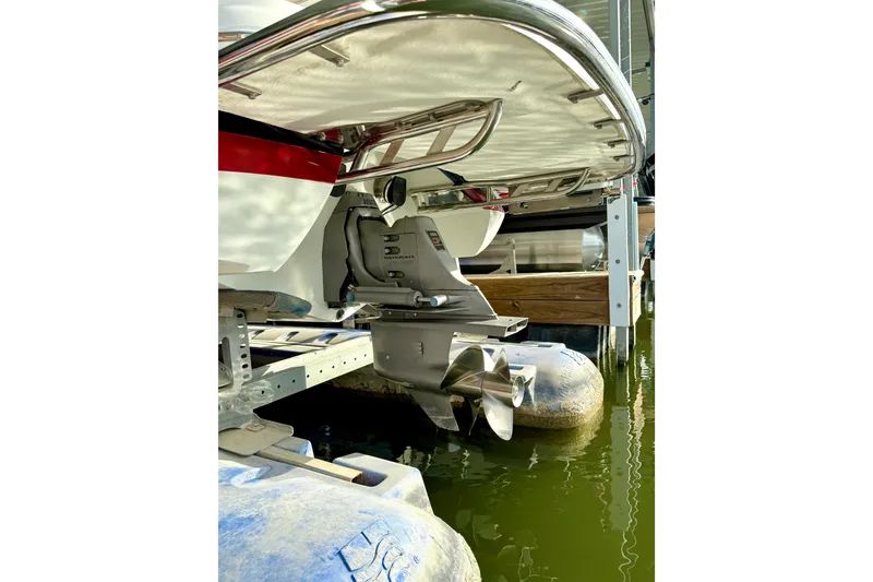 Slide: The Image of Rear view of a 2006 Cobalt 272 boat with visible propeller and outdrive. - 56
