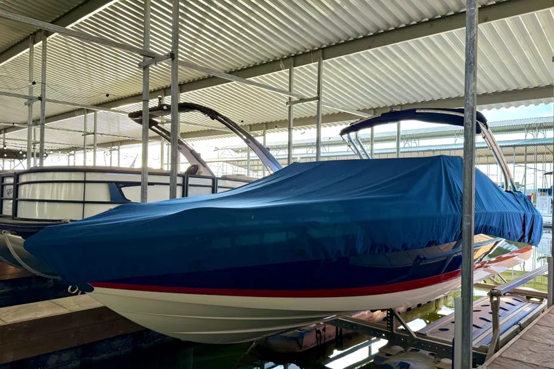 Slide: The Image of Covered 2006 Cobalt 272 boat in a marina storage area. - 58