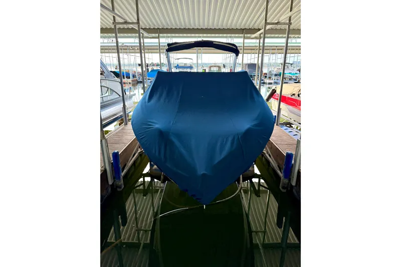 Slide: The Image of Covered 2006 Cobalt 272 boat docked in a marina. - 60