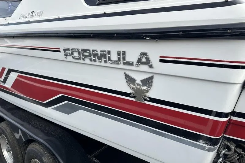 Slide: The Image of 1989 Formula 292 SR-1 boat with red, black, and white detailing. - 13