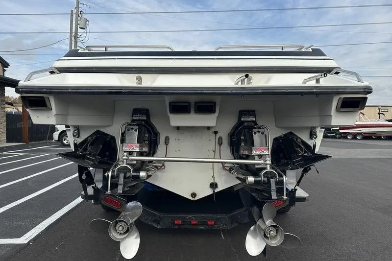 Slide: The Image of 1989 Formula 292 SR-1 boat rear view with dual propellers and outboard motors. - 14