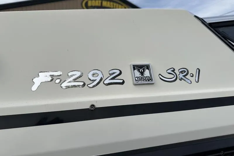 Slide: The Image of 1989 Formula 292 SR-1 boat emblem on white surface. - 17