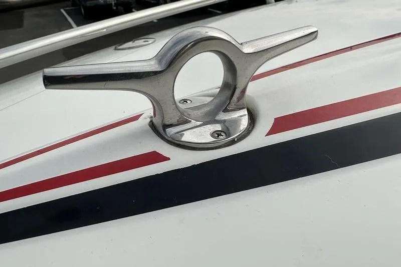 Slide: The Image of Close-up of a 1989 Formula 292 SR-1 boat cleat with red and black stripes. - 19