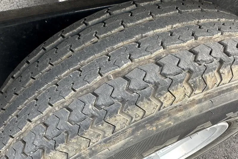 Slide: The Image of Close-up of a worn tire tread on a 1989 Formula 292 SR-1 vehicle. - 29