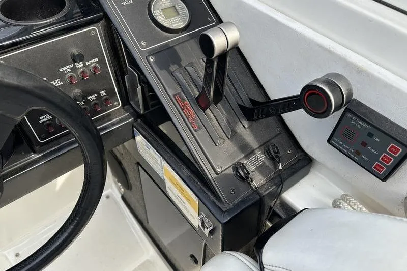 Slide: The Image of 1989 Formula 292 SR-1 boat dashboard with controls and steering wheel. - 40