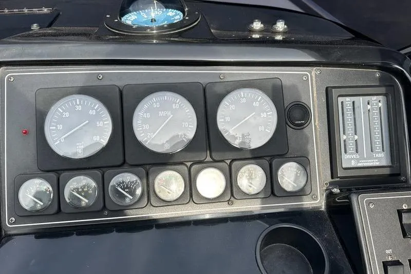 Slide: The Image of Dashboard of a 1989 Formula 292 SR-1 boat with gauges and controls. - 42