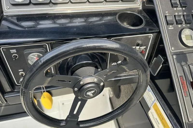 Slide: The Image of Steering wheel and dashboard of a 1989 Formula 292 SR-1 boat. - 44