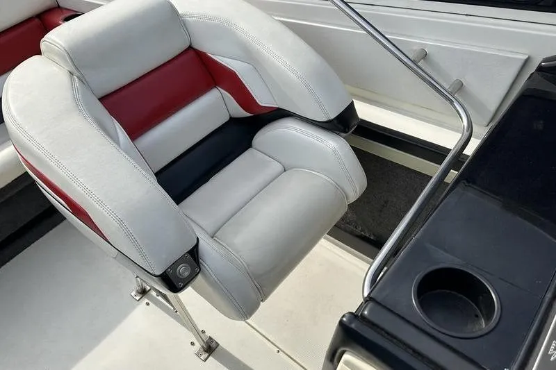 Slide: The Image of 1989 Formula 292 SR-1 boat seat with red and white upholstery, cup holder visible. - 46