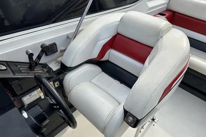 Slide: The Image of 1989 Formula 292 SR-1 boat interior with white and red seating, steering wheel, and controls. - 51