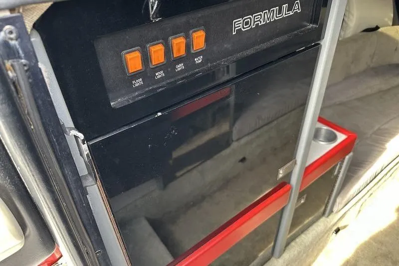 Slide: The Image of 1989 Formula 292 SR-1 interior with control panel and seating area. - 55