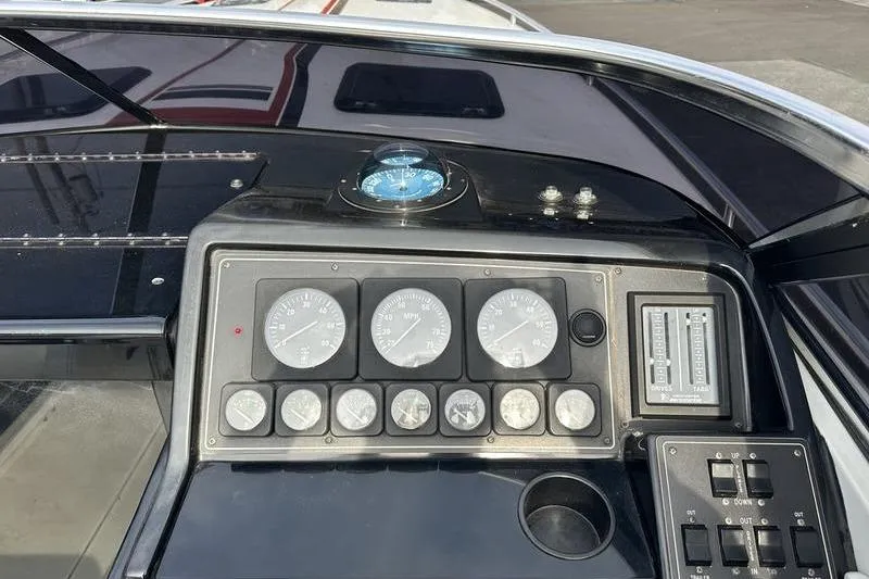 Slide: The Image of Dashboard of a 1989 Formula 292 SR-1 boat with gauges and controls. - 58