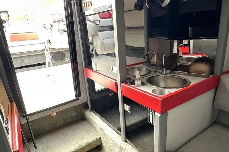 Slide: The Image of 1989 Formula 292 SR-1 boat interior with compact kitchen and sink area. - 59