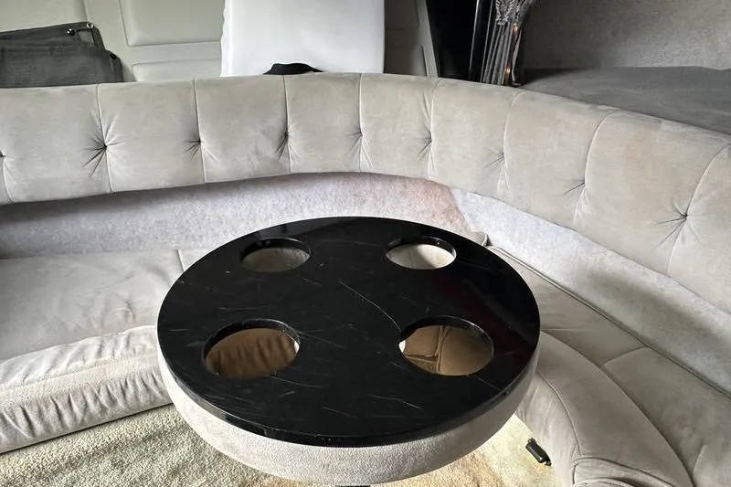 Slide: The Image of 1989 Formula 292 SR-1 interior with round table and cushioned seating. - 61