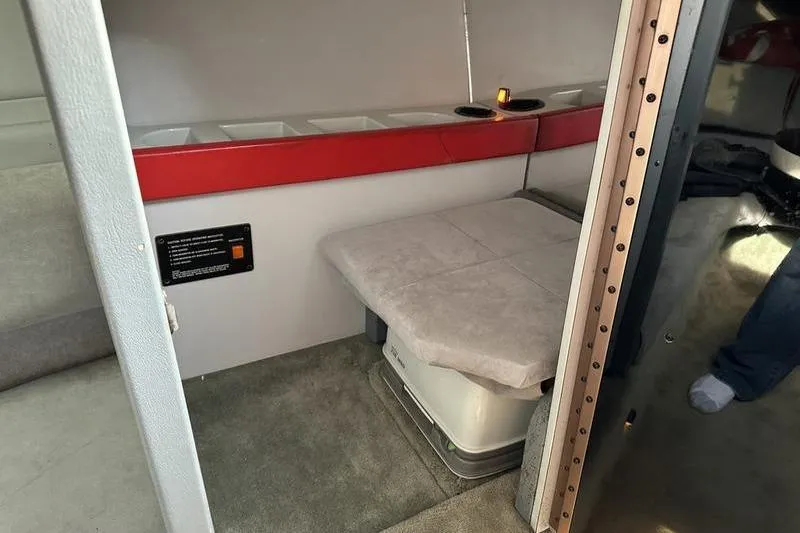 Slide: The Image of Interior cabin of a 1989 Formula 292 SR-1 boat with seating and storage. - 68