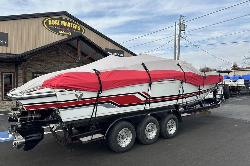 Slide: The Image of 1989 Formula 292 SR-1 boat on trailer, covered, outside Boat Masters Marine. - 7