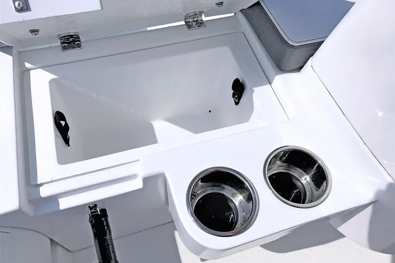 Slide: The Image of Manufacturer Provided Image: Walker Bay Generation 12 LTE 2024 boat storage compartment with dual cup holders. - 5