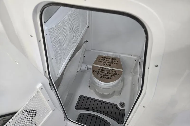 Slide: The Image of Interior view of 2026 Sea Hunt Gamefish 25 boat's compact restroom area. - 14