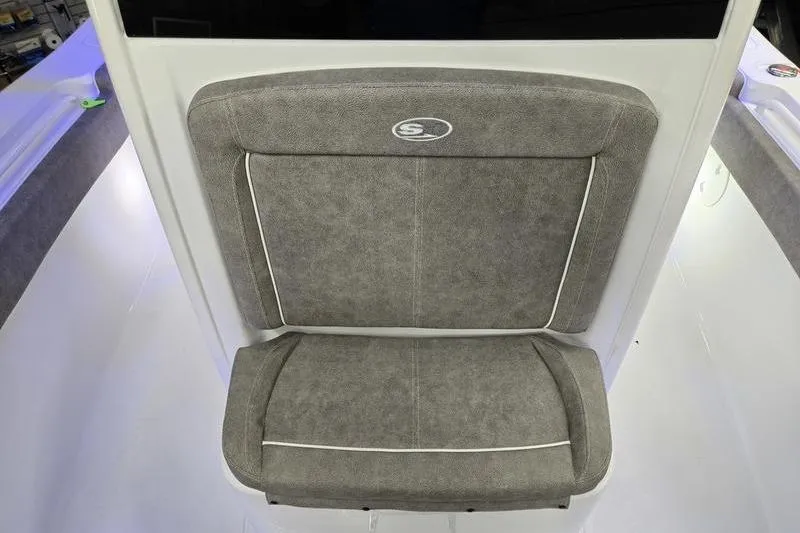 Slide: The Image of 2026 Sea Hunt Gamefish 25 boat seat with gray upholstery and white trim. - 15