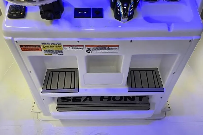 Slide: The Image of 2026 Sea Hunt Gamefish 25 console with controls, illuminated in blue light. - 16