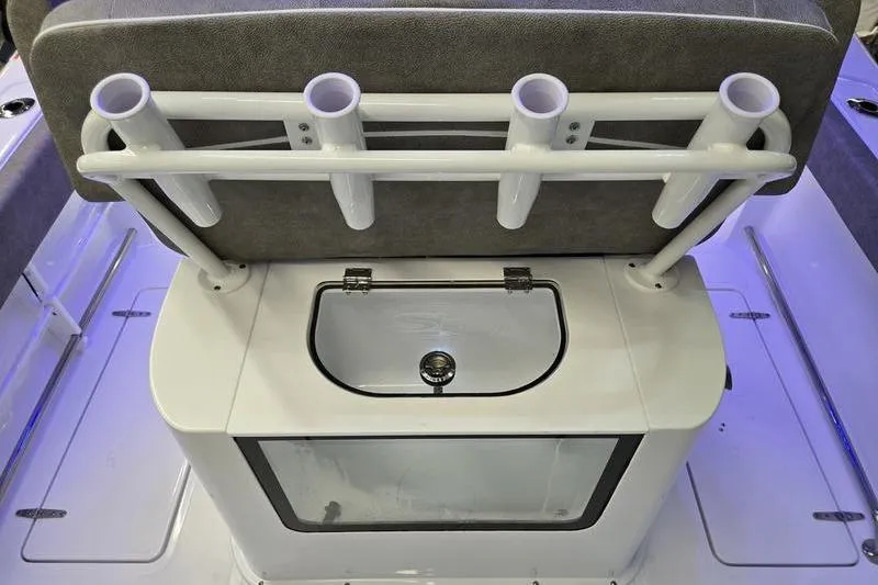 Slide: The Image of 2026 Sea Hunt Gamefish 25 boat seating with rod holders and storage compartment. - 24