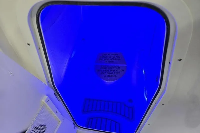 Slide: The Image of Blue-lit compartment in 2026 Sea Hunt Gamefish 25 boat interior. - 9