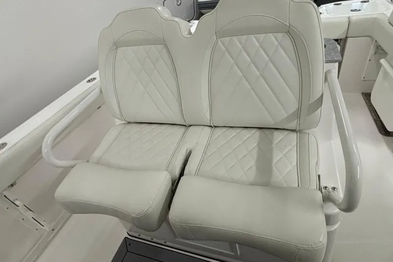 Slide: The Image of 2023 Everglades 285 Center Console boat with luxurious white leather seating. - 13