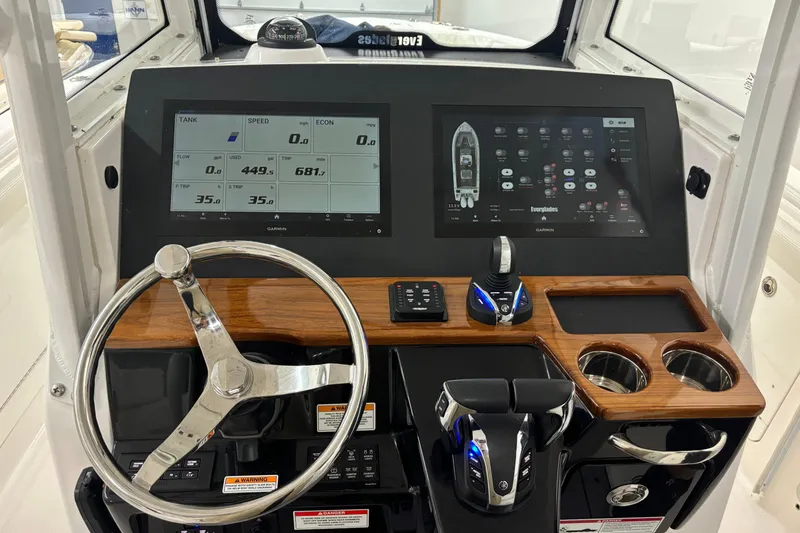 Slide: The Image of 2023 Everglades 285 Center Console dashboard with advanced navigation and control systems. - 15